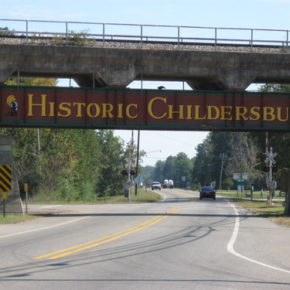 A view of a highway featuring a bridge spanning across it